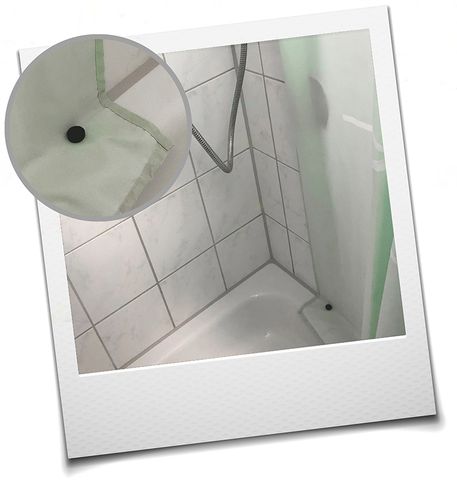Rubberised disc magnet holding a shower curtain in place Rubberised disc magnet holding a shower curtain in place